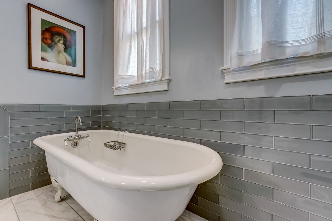 22 North 4th Street Fernandina Beach, FL 32034 - Photo 34 of 100 a white bath tub sitting in a bathroom