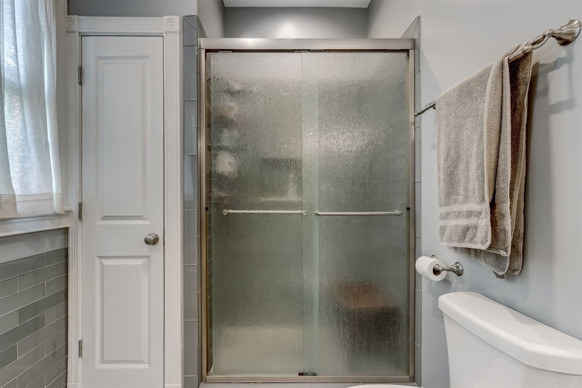 22 North 4th Street Fernandina Beach, FL 32034 - Photo 35 of 100 a bathroom with a shower and a toilet