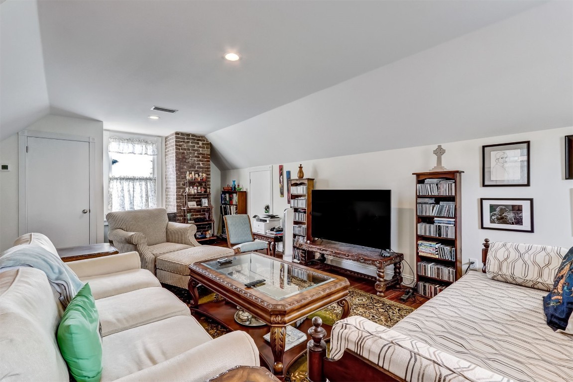 22 North 4th Street Fernandina Beach, FL 32034 - Photo 52 of 100 a living room with furniture a flat screen tv and a large window