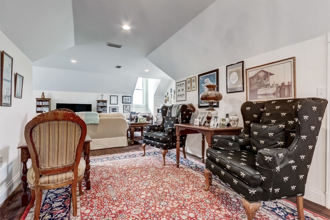 22 North 4th Street Fernandina Beach, FL 32034 - Photo 55 of 100 a living room with furniture a piano and a bookshelf