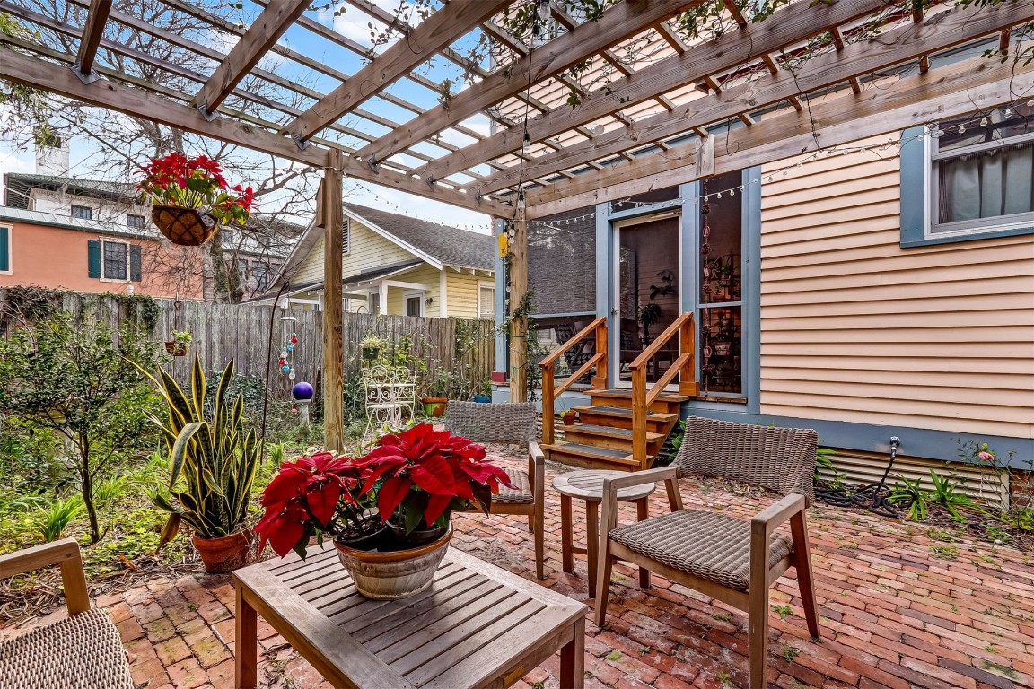 22 North 4th Street Fernandina Beach, FL 32034 - Photo 62 of 100 Sitting area under the trellis overlooking the garden at 22 N. 4th St.