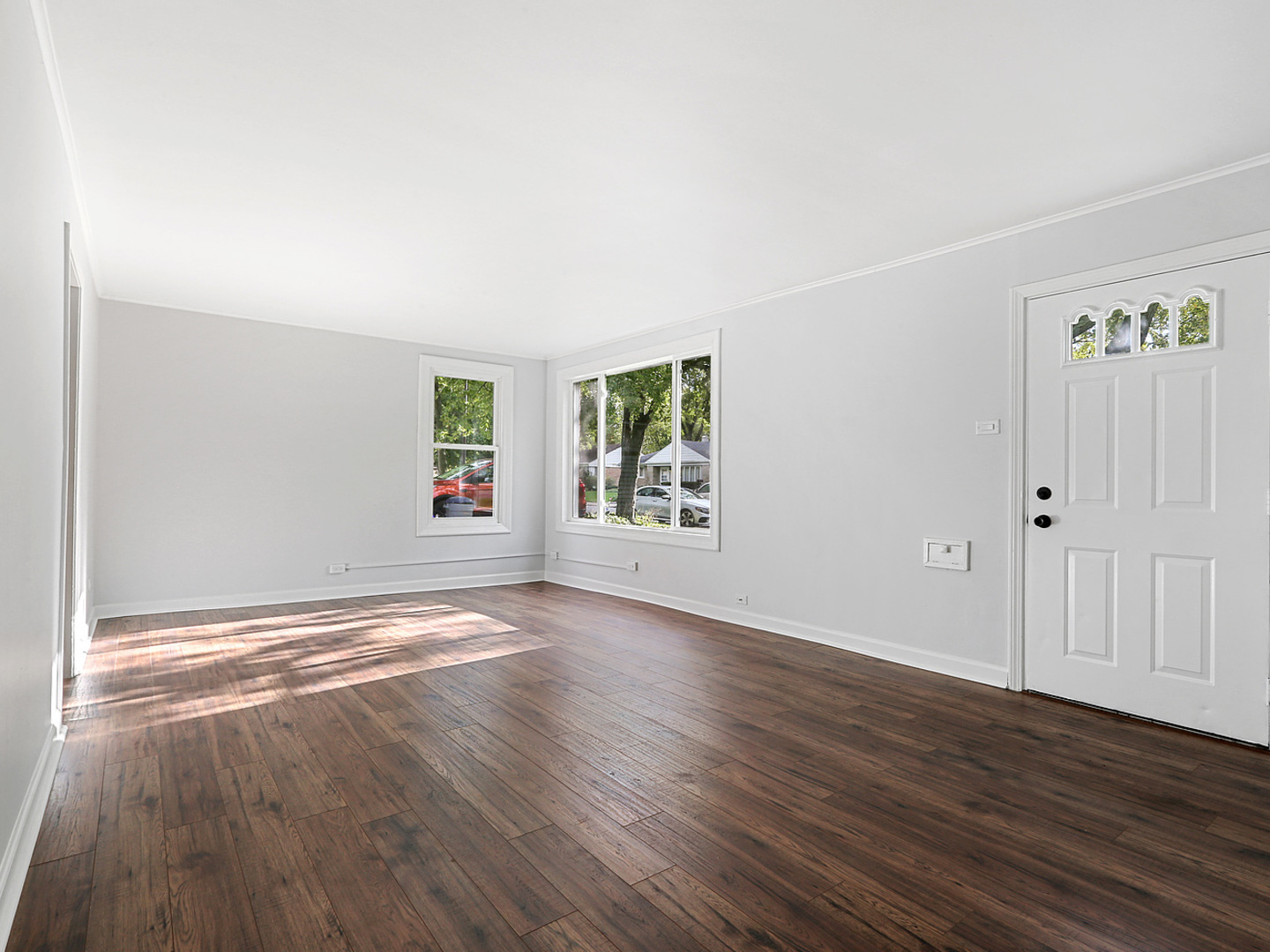 336 Manitowac Street Park Forest, IL 60466 - Photo 3 of 13 an empty room with wooden floor and windows