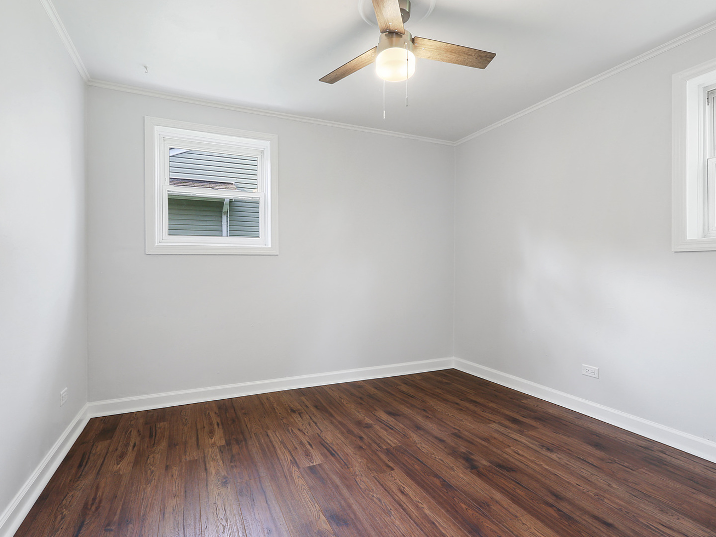 336 Manitowac Street Park Forest, IL 60466 - Photo 8 of 13 wooden floor in an empty room with a window