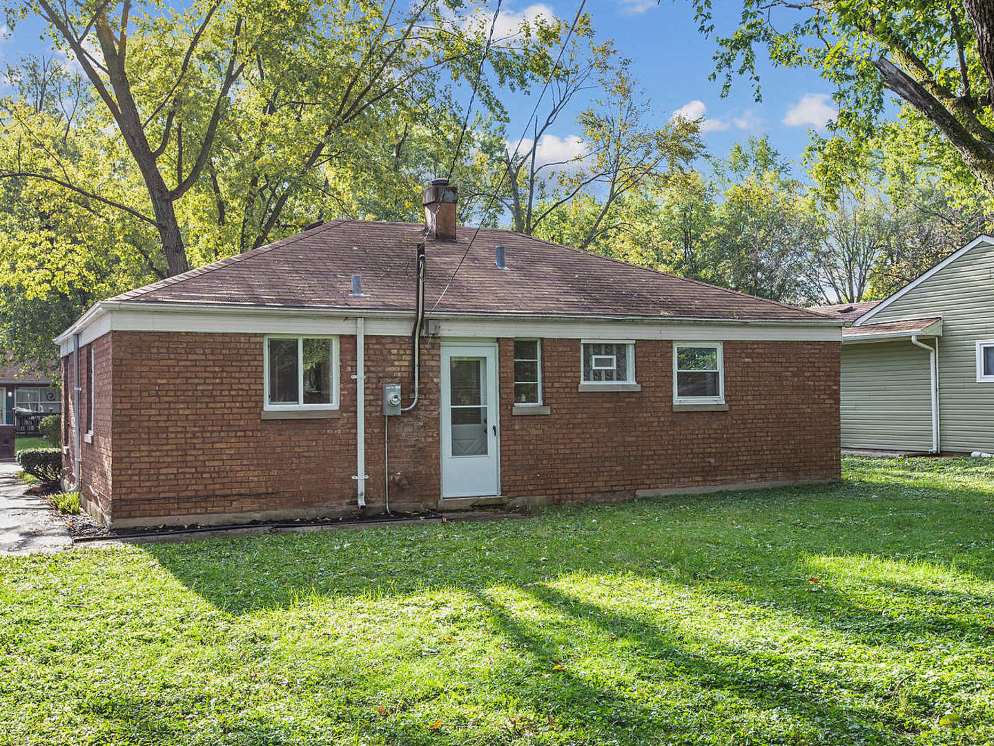 336 Manitowac Street Park Forest, IL 60466 - Photo 10 of 13 a front view of a house with a garden