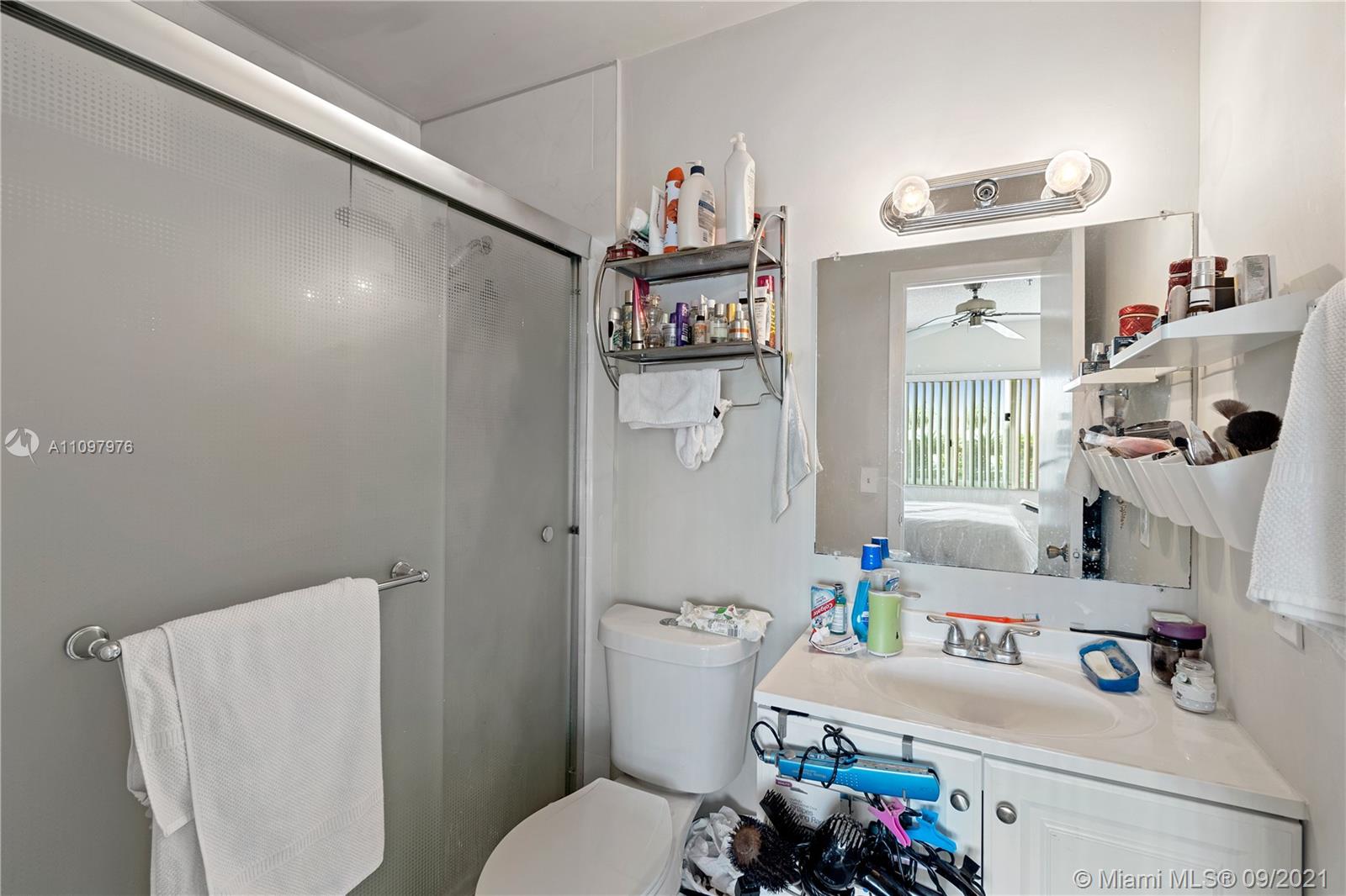 184 Riviera Circle, Unit 325 Weston, FL 33326 - Photo 15 of 27 a white bath tub sitting next to a white toilet and sink