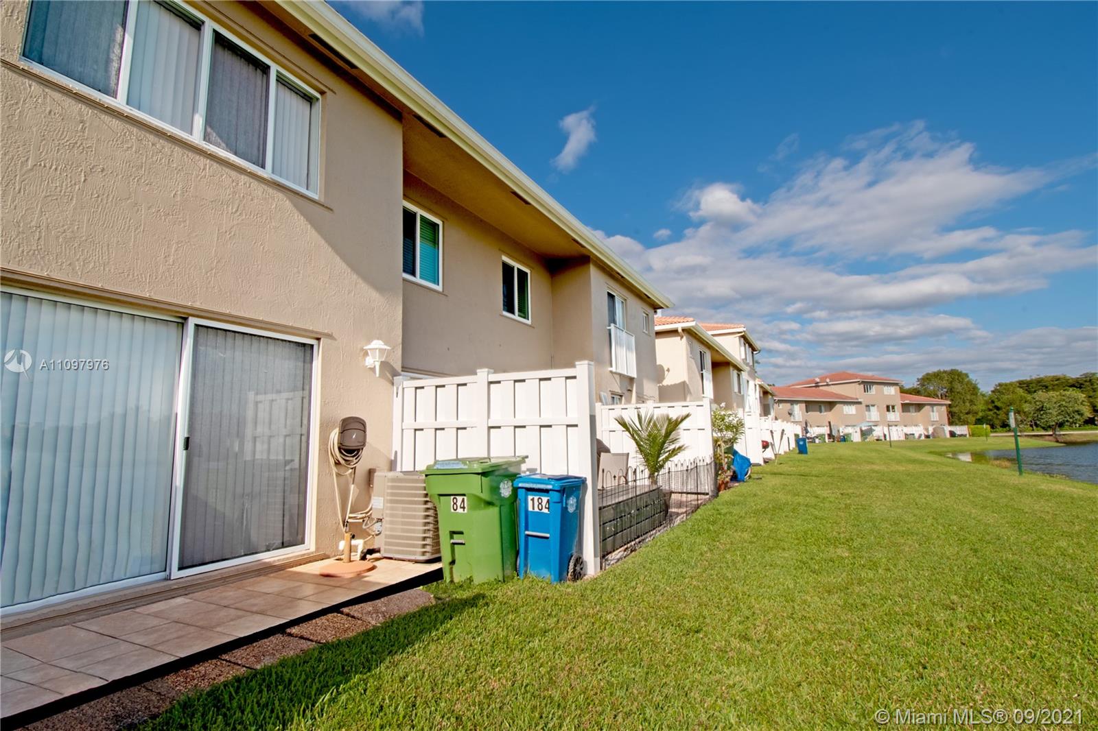 184 Riviera Circle, Unit 325 Weston, FL 33326 - Photo 19 of 27 a view of a house with a yard