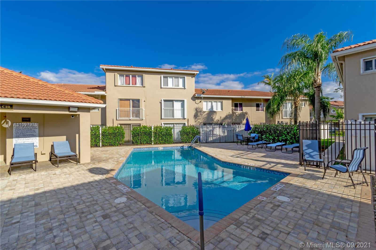 184 Riviera Circle, Unit 325 Weston, FL 33326 - Photo 23 of 27 a view of a house with backyard patio and swimming pool