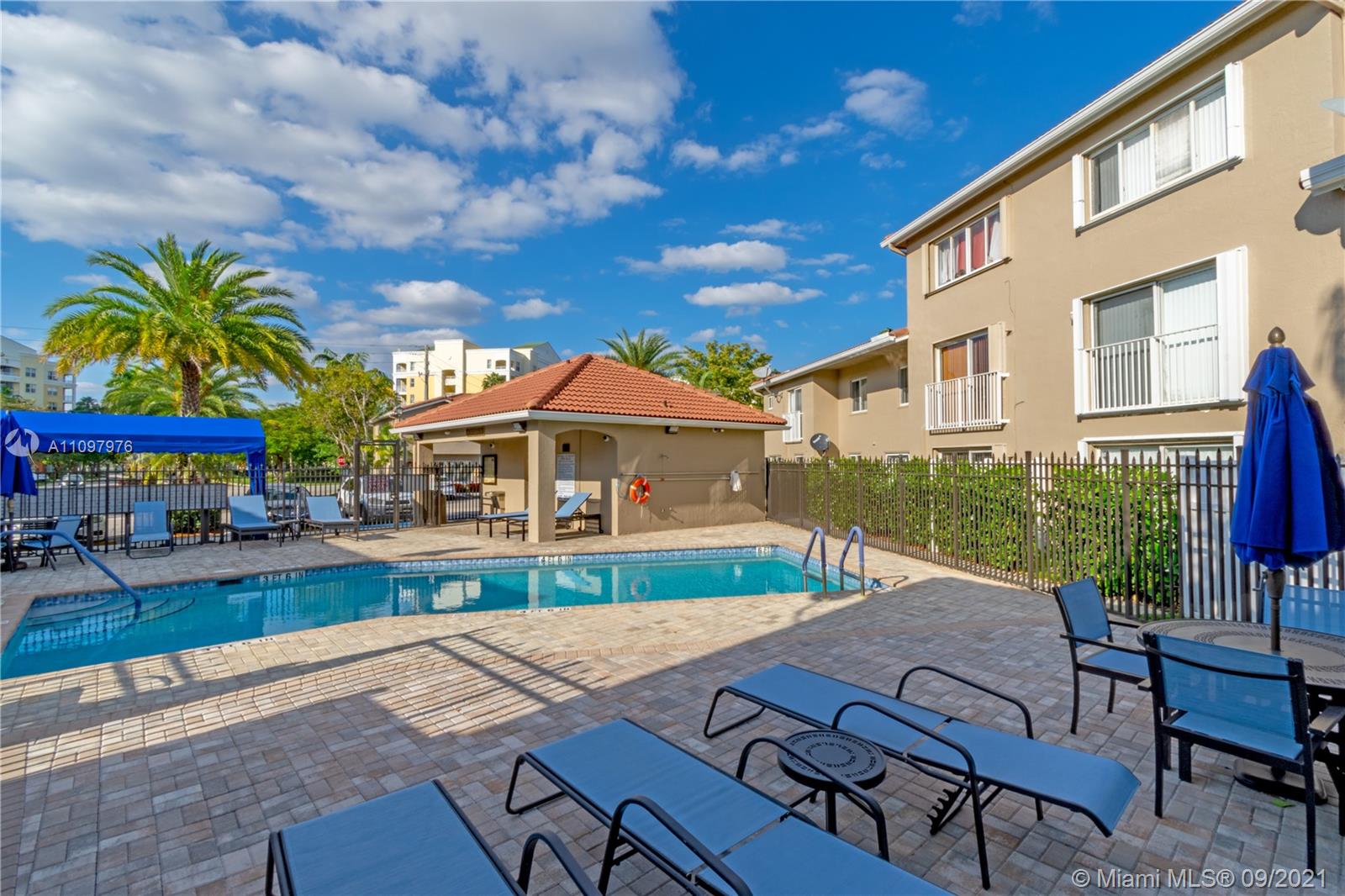 184 Riviera Circle, Unit 325 Weston, FL 33326 - Photo 25 of 27 a view of an house with backyard and furniture