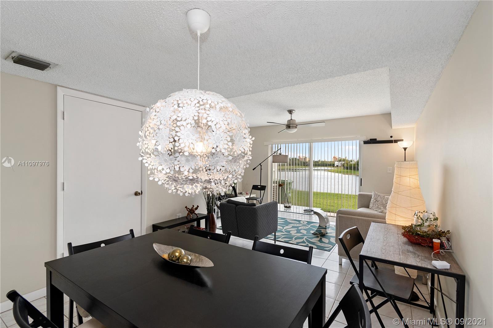184 Riviera Circle, Unit 325 Weston, FL 33326 - Photo 4 of 27 a view of a dining room with furniture window and outside view