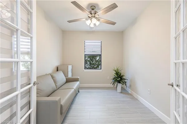 a living room with furniture and a window