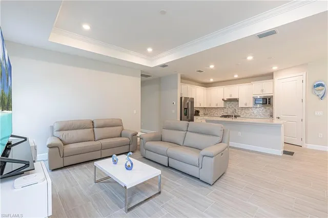 a living room with furniture white walls and white walls