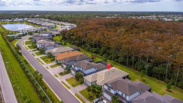 an aerial view of residential houses with outdoor space