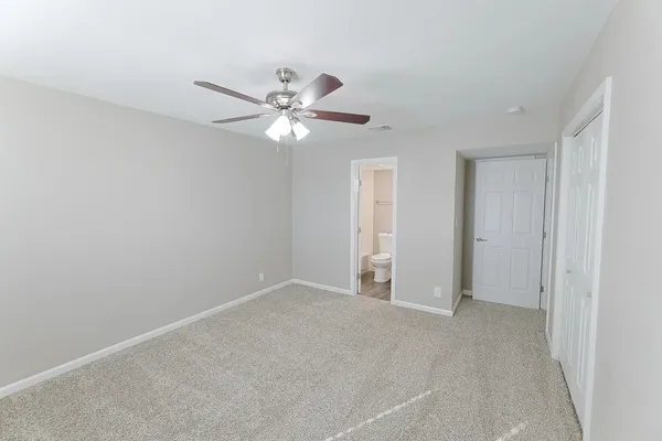 a view of an empty room with a fan