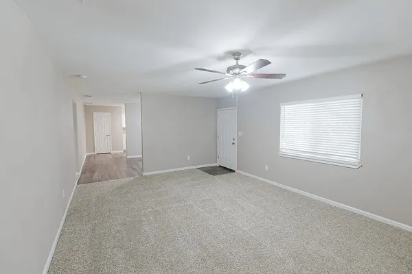 a view of an empty room with a window