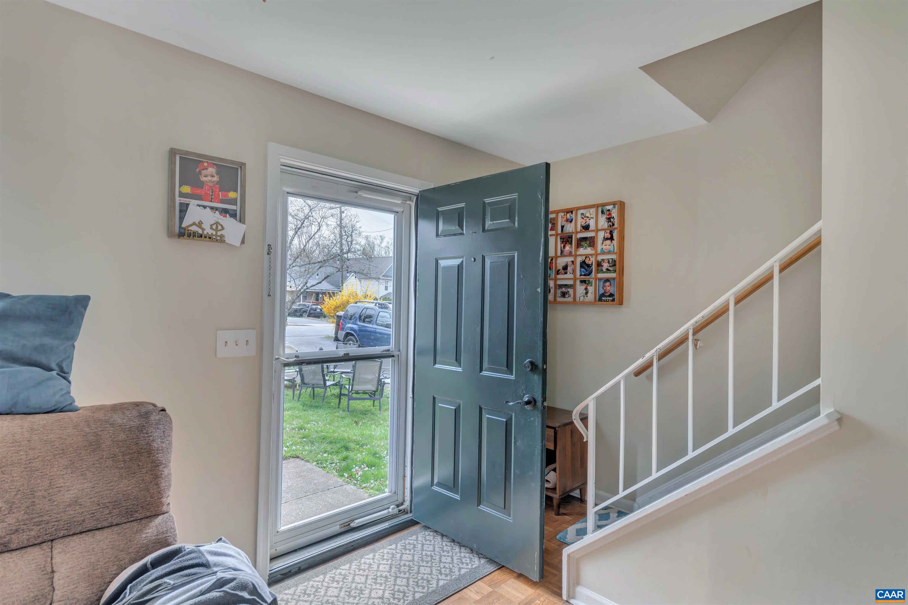 113 Summit Street, Unit 113 Charlottesville, VA 22903 - Photo 4 of 15 a living room with furniture and a window