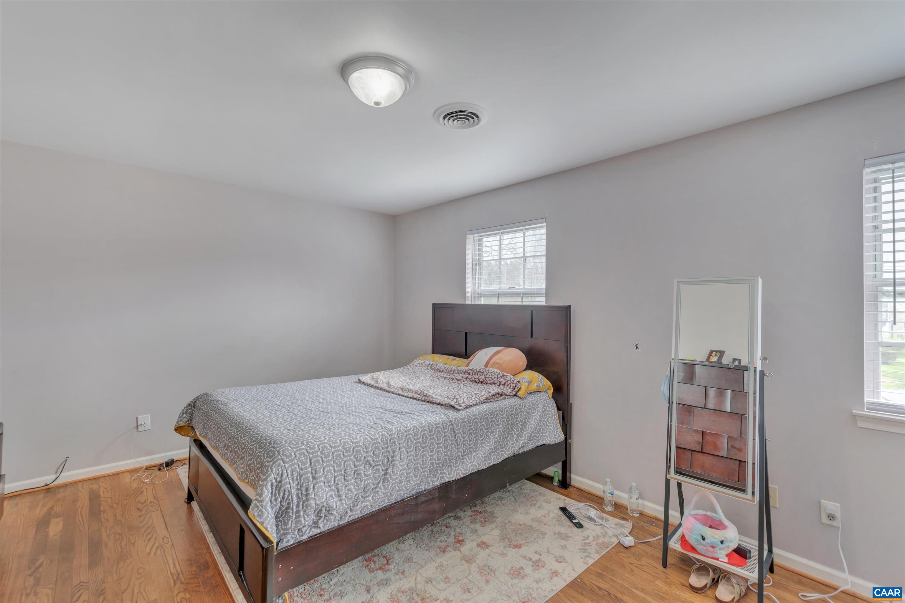 113 Summit Street, Unit 113 Charlottesville, VA 22903 - Photo 10 of 15 a bedroom with a bed and a dresser
