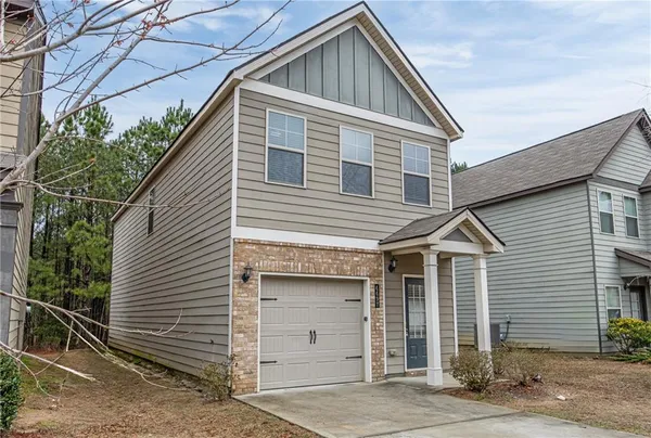 a front view of a house with a garage