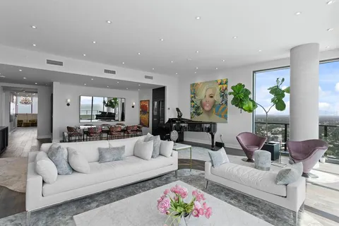a kitchen with cabinets stainless steel appliances and a sink