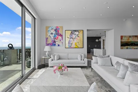 a kitchen with a sink dishwasher a stove and a refrigerator with wooden floor