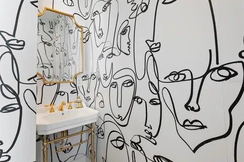 a white bath tub sitting in a bathroom