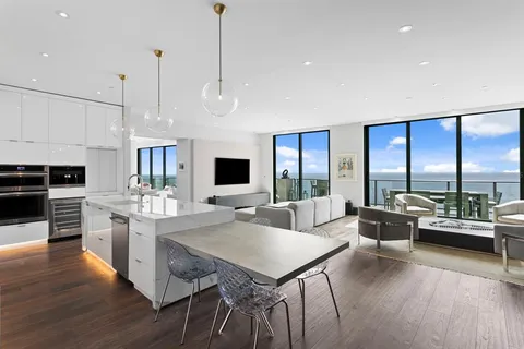 a bedroom with a bed mirror and window