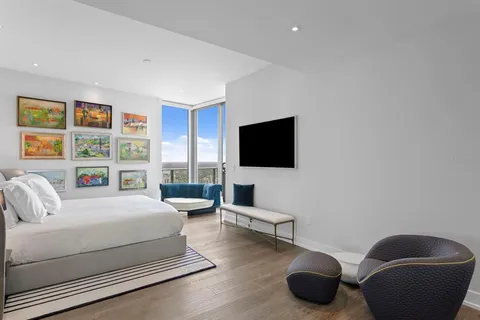 a view of a terrace with lawn chairs