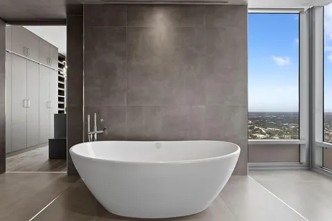 a swimming pool with outdoor seating and yard