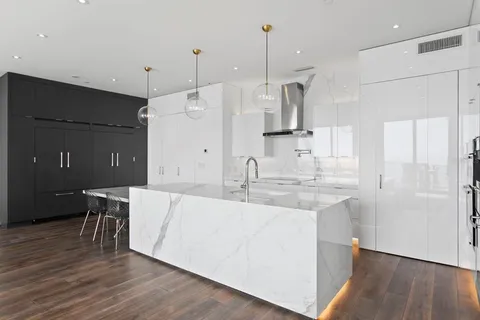 a living room with furniture and flowers