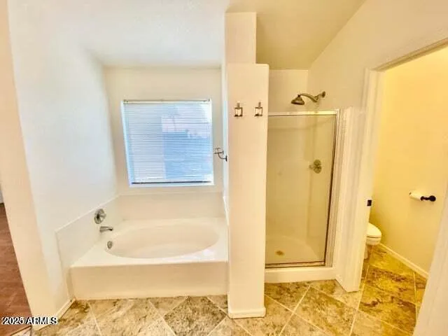 a bathroom with a tub shower and a sink