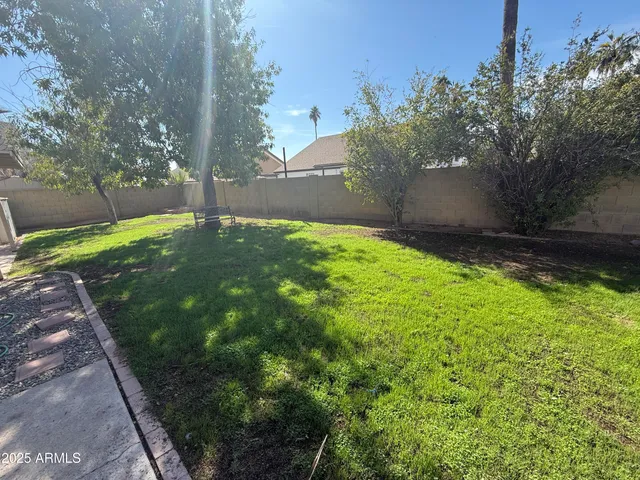 a backyard of a house with lots of green space