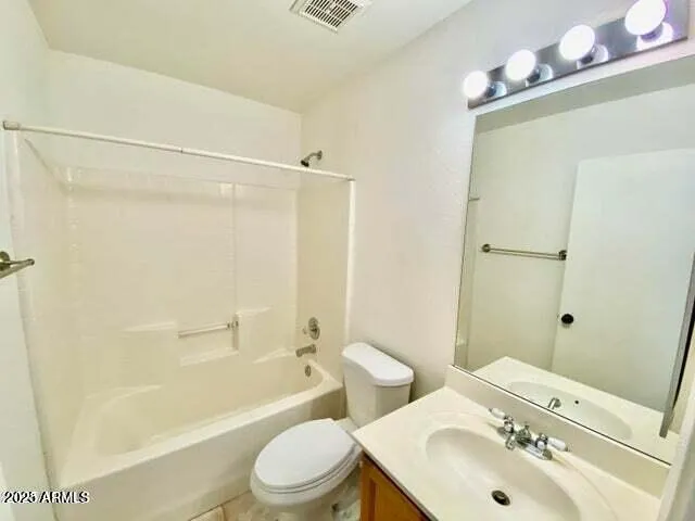 a bathroom with a sink mirror toilet and bathtub