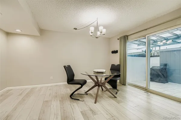 a view of a dining room with furniture window and wooden floor