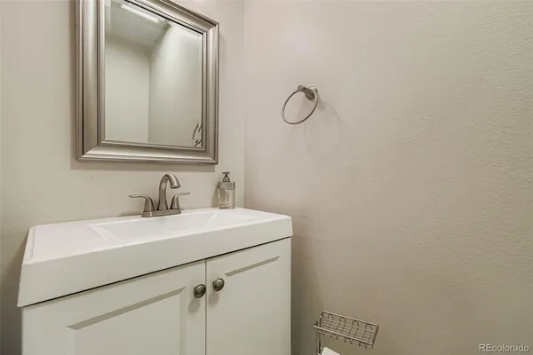 a bathroom with a sink and mirror