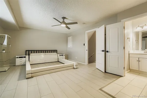 a living room with a bed and a cabinets