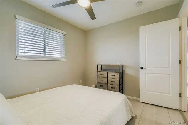 a bedroom with a bed and a closet