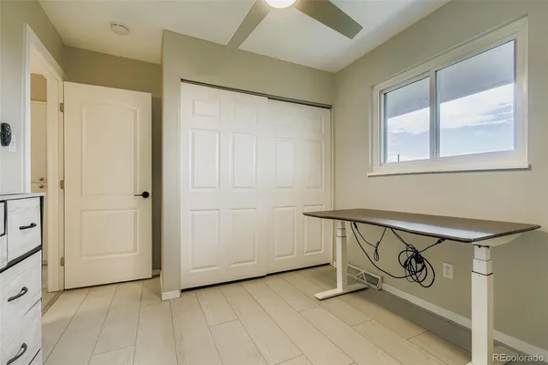 a view of a hallway with windows
