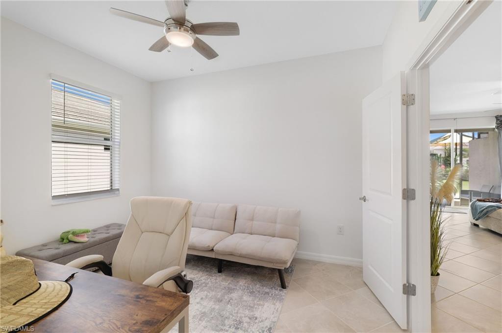 2052 Vermont Lane Naples, FL 34120 - Photo 18 of 35 a living room with furniture and a window