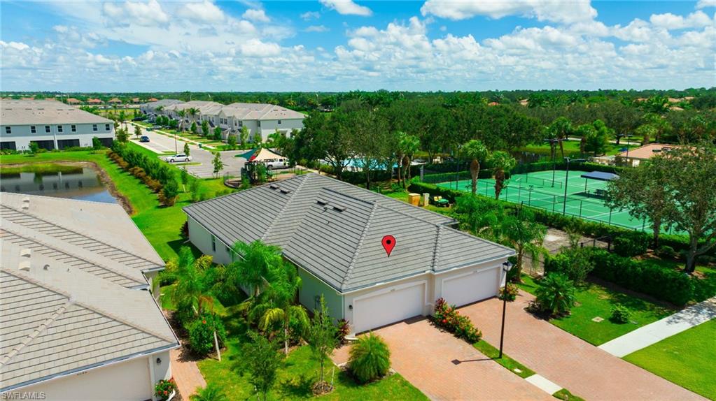 2052 Vermont Lane Naples, FL 34120 - Photo 2 of 35 a view of a terrace with a garden