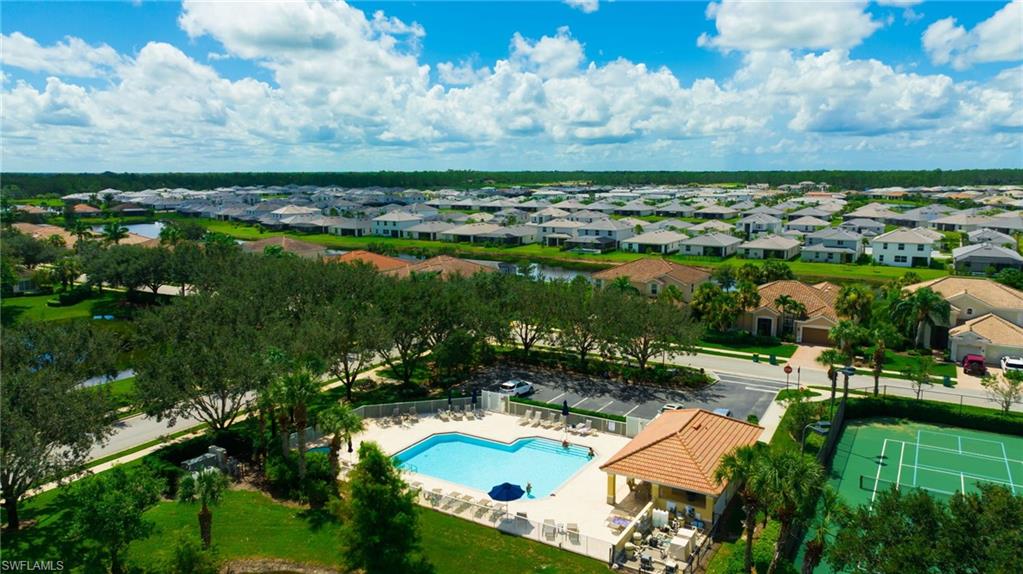 2052 Vermont Lane Naples, FL 34120 - Photo 26 of 35 an aerial view of residential houses with outdoor space and lake view