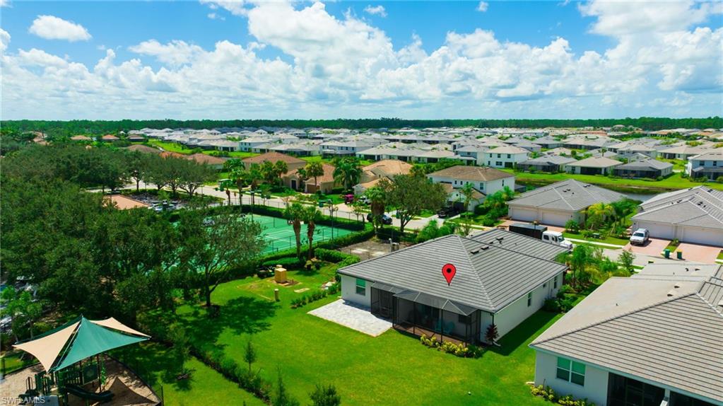 2052 Vermont Lane Naples, FL 34120 - Photo 30 of 35 an aerial view of house with yard swimming pool and outdoor seating