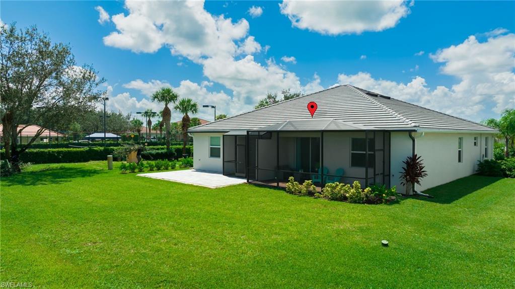 2052 Vermont Lane Naples, FL 34120 - Photo 31 of 35 a front view of a house with garden
