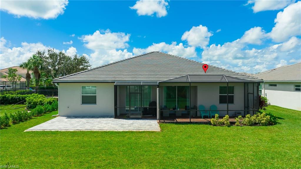 2052 Vermont Lane Naples, FL 34120 - Photo 32 of 35 a front view of a house with garden