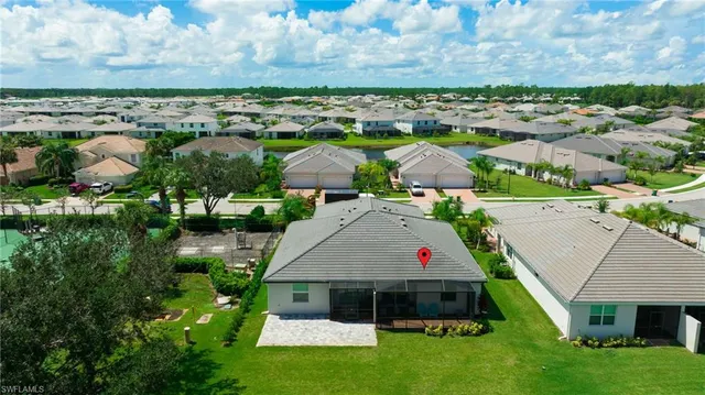 a view of swimming pool with a garden and seating area