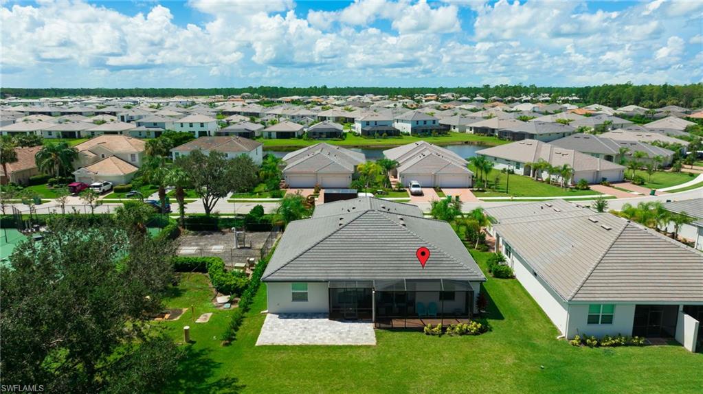 2052 Vermont Lane Naples, FL 34120 - Photo 33 of 35 an aerial view of multiple houses with yard