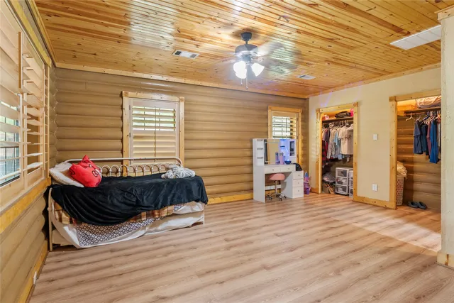 a view of a big yard with lots of bushes