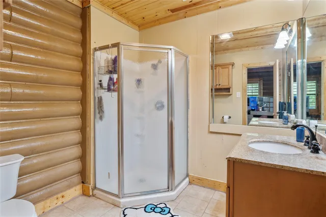 a kitchen with stainless steel appliances granite countertop sink cabinets and wooden floor