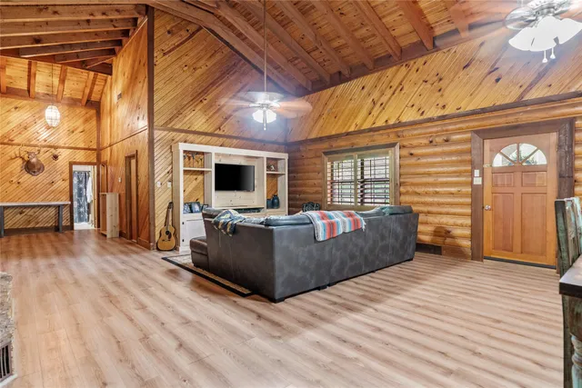 a bedroom with a bed and a television