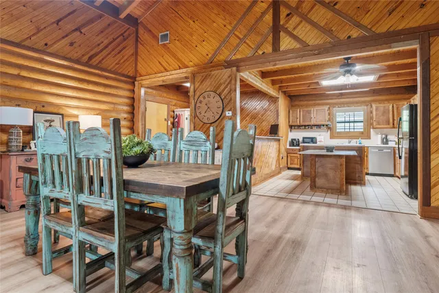 a kitchen with a refrigerator a stove a sink and a cabinets