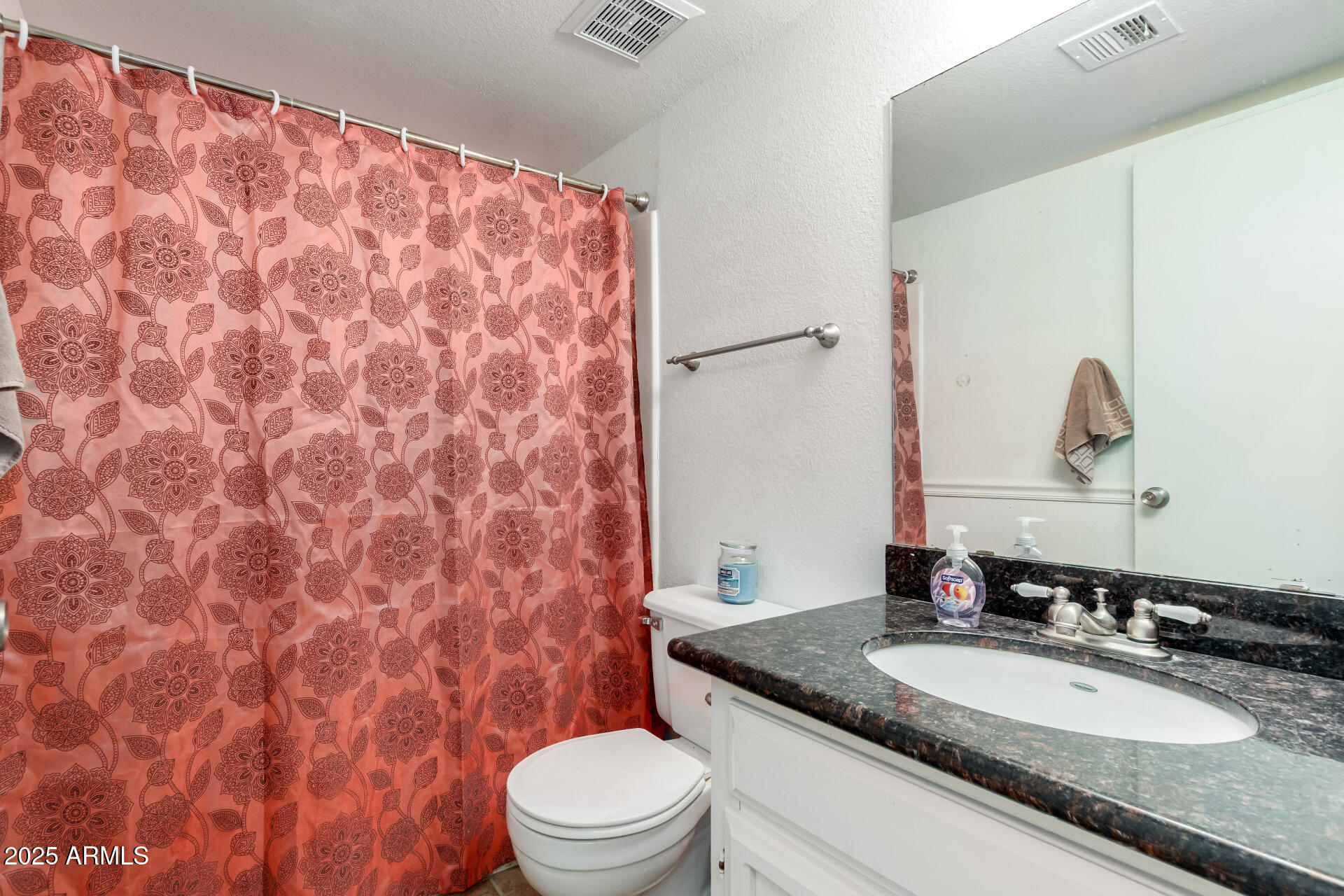 1927 East Hampton Avenue, Unit 129 Mesa, AZ 85204 - Photo 16 of 23 a bathroom with a granite countertop sink and a mirror