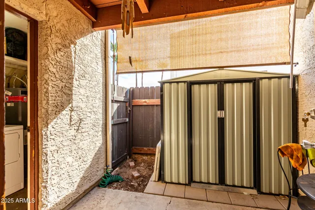 a view of a porch with furniture and front door